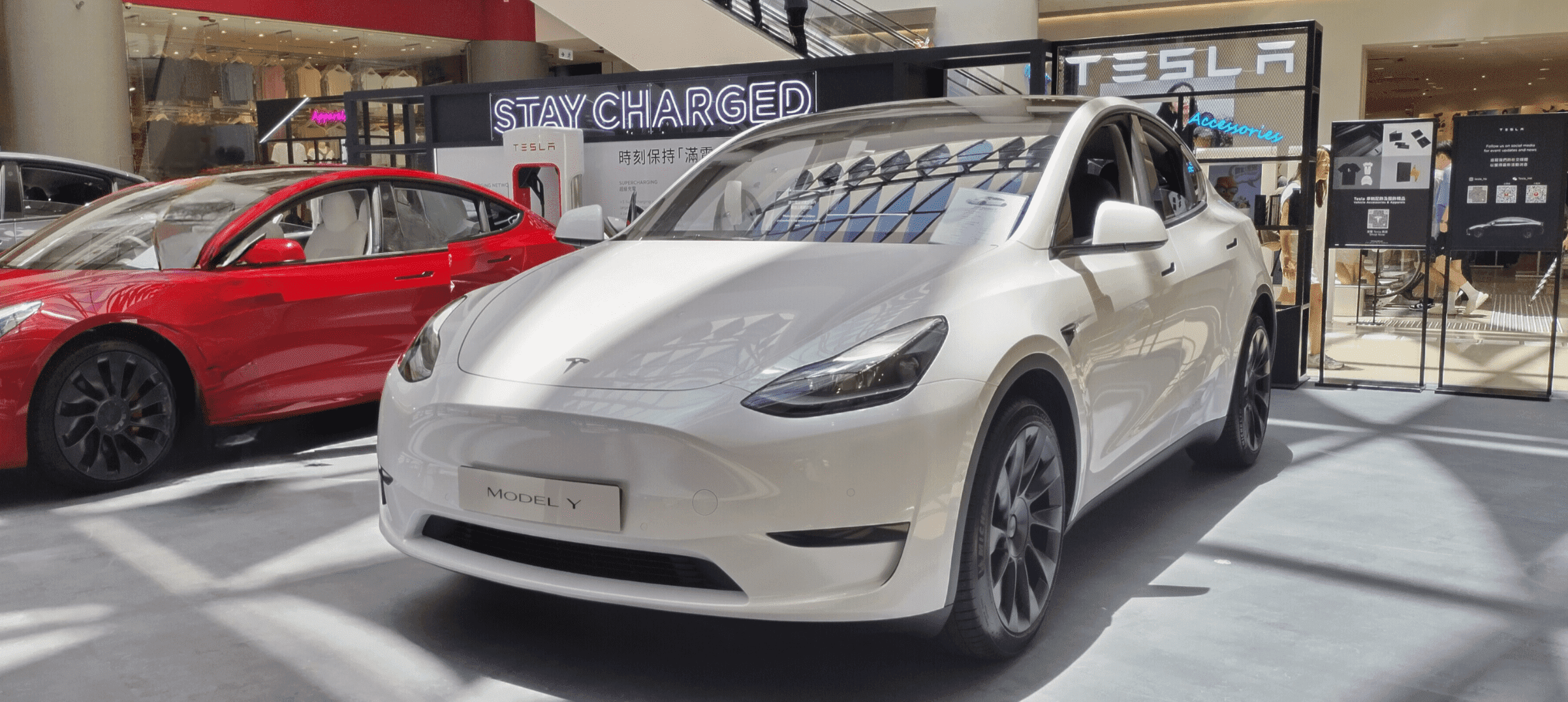 Tesla Model Y promotional display in Olympian City.
